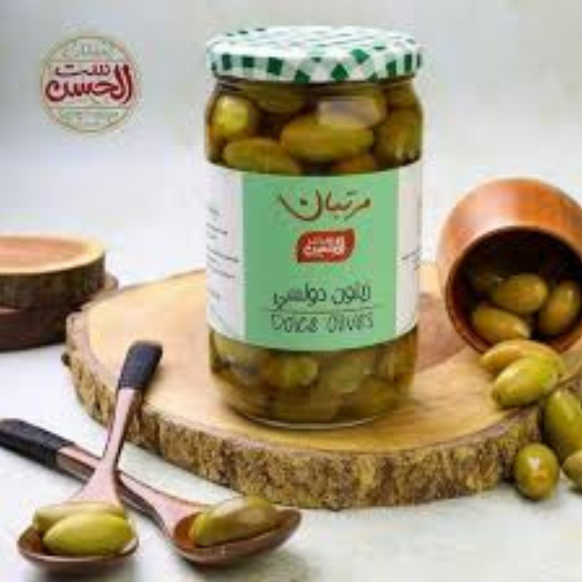 A jar of Bostan Setelhosn Green Dolce Seedless Olives, featuring seedless, sweet, and firm green olives perfect for snacks and Mediterranean dishes