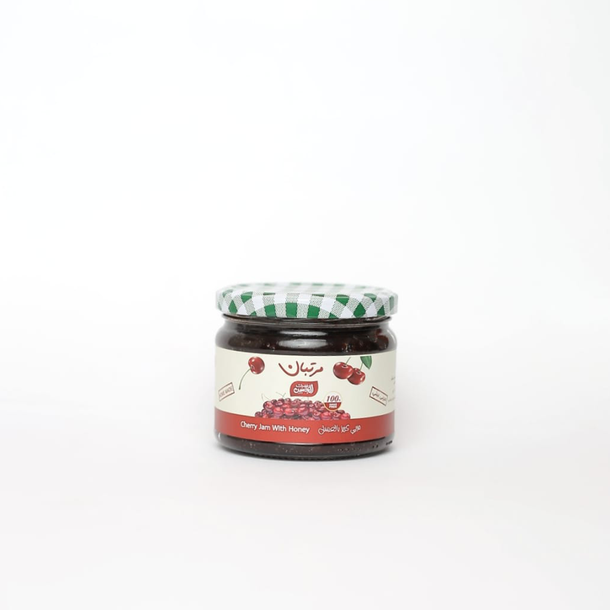 Jar of Cherry Jam from Bostan Set El Hosn, 300 gm, featuring a green and white checkered lid and a label with both Arabic and English text.