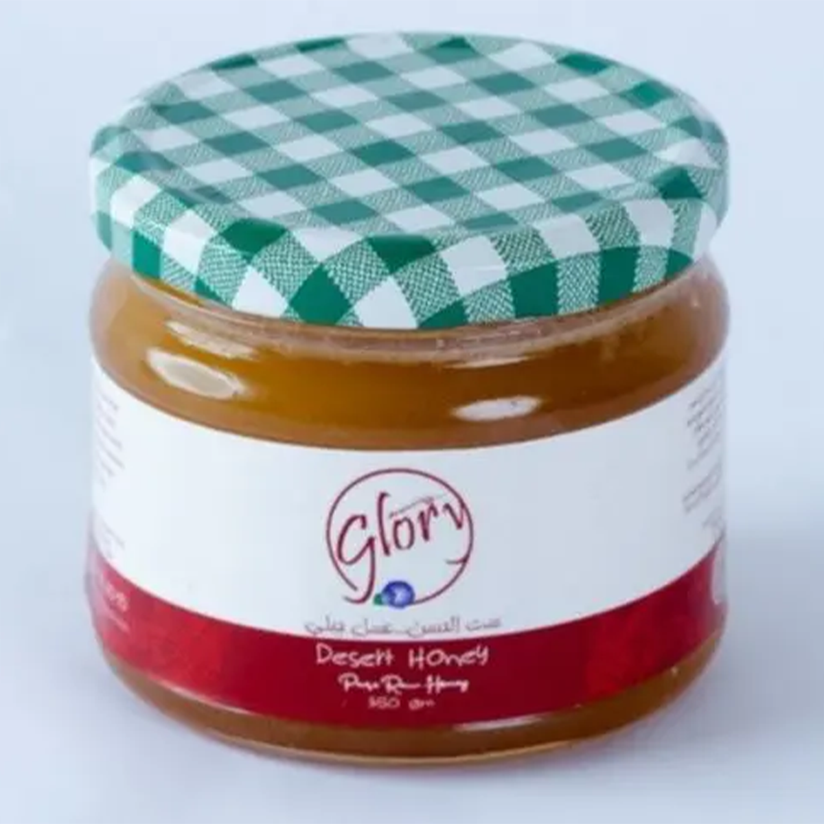 Jar of Glory Sidr Honey from Bostan Set El Hosn, 350 gr, featuring a green and white checkered lid and a label with both Arabic and English text.