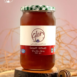 Jar of Glory Sidr Honey from Bostan Set El Hosn, 950 gr, featuring a green and white checkered lid and a label with both Arabic and English text.