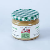 Jar of Glory Honey from Bostan Set El Hosn, 350 gm, featuring a green and white checkered lid and a label with both Arabic and English text