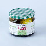 Jar of Labna with Basil and Garlic in Olive Oil from Bostan Set El Hosn, 250 gm, featuring a green and white checkered lid and a label with both Arabic and English text